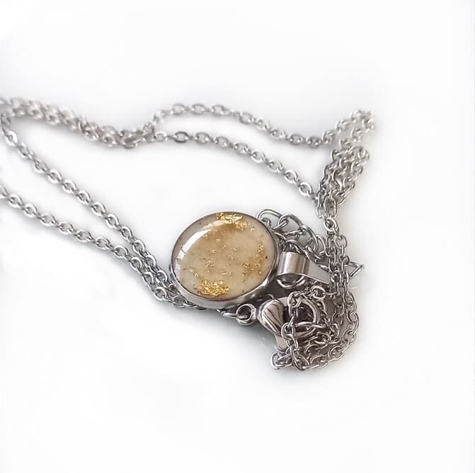 Necklace with breast milk, baby hair & gold leaf pendant