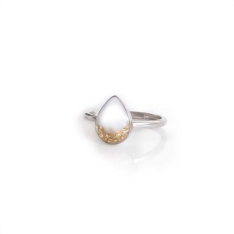 Drop ring with breast milk and gold leaf pieces